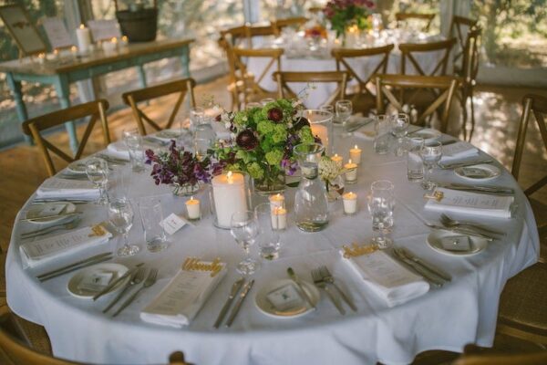 1.8M-Round-Table-Princess-Cutlery-White-Linen-Glassware-Timber-Cross-Back-Chairs
